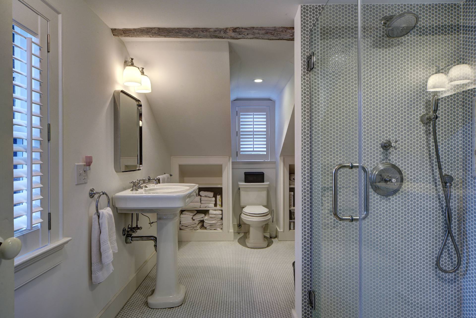 16 Jefferson Street Sag Harbor, NY 11963 - Photo 12 of 22 a bathroom with a granite countertop sink a toilet and mirror