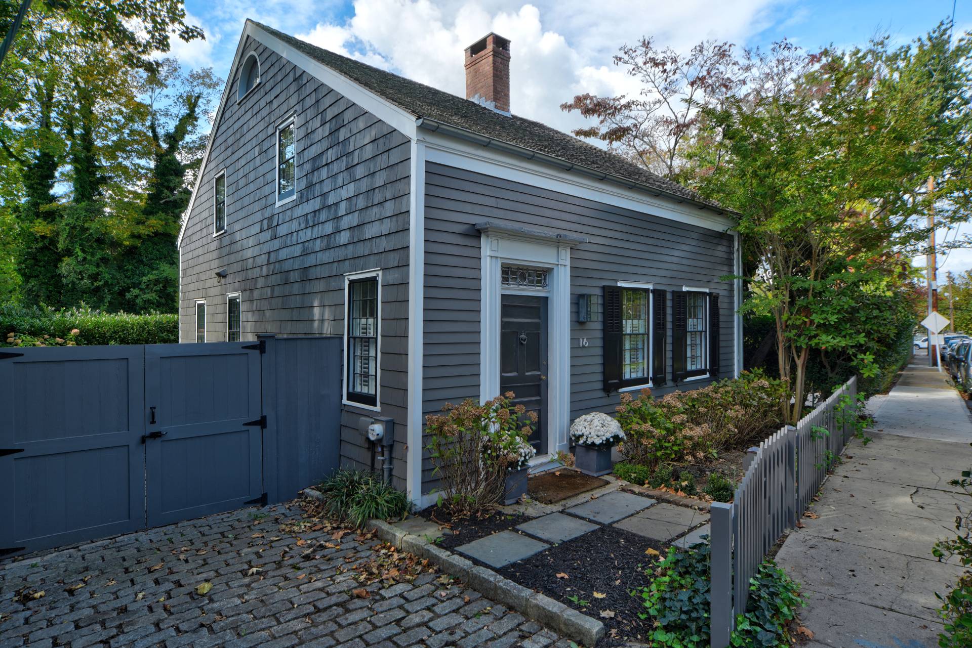 16 Jefferson Street Sag Harbor, NY 11963 - Photo 2 of 22 a view of a house with a small yard plants and large tree