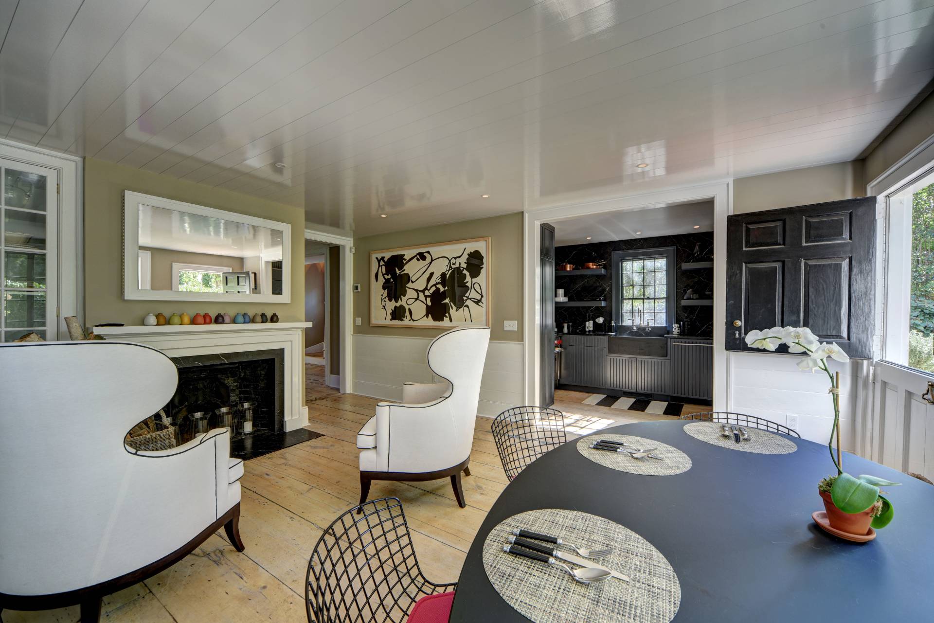 16 Jefferson Street Sag Harbor, NY 11963 - Photo 7 of 22 a living room with furniture and a fireplace