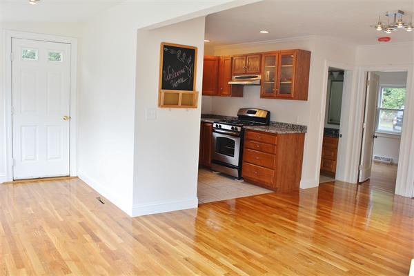 11 Bush Street Wareham, MA 02532 - Photo 11 of 17 a kitchen with stainless steel appliances granite countertop a stove top oven and sink
