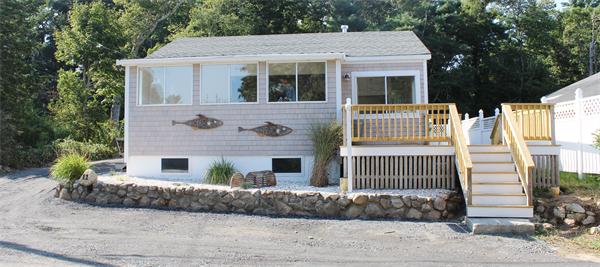 11 Bush Street Wareham, MA 02532 - Photo 2 of 17 a front view of a house with a yard