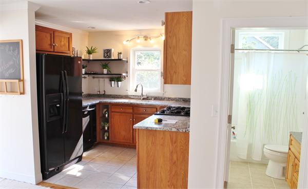 11 Bush Street Wareham, MA 02532 - Photo 3 of 17 a kitchen with stainless steel appliances granite countertop a refrigerator a sink and a stove
