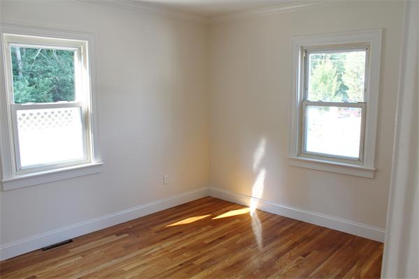 11 Bush Street Wareham, MA 02532 - Photo 8 of 17 an empty room with wooden floor and windows
