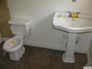 515 Absher Road Bessemer City, NC 28016 - Photo 16 of 16 a bathroom with a toilet and a sink