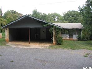515 Absher Road Bessemer City, NC 28016 - Photo 3 of 16 a front view of a house with a yard and garage