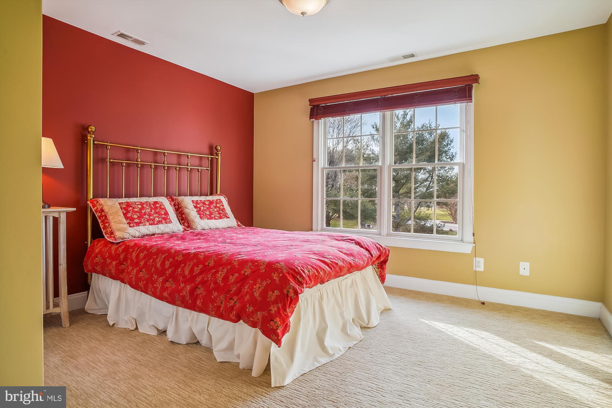2802 Cox Neck Road Chester, MD 21619 - Photo 28 of 55 a large bed sitting in a bedroom next to a window