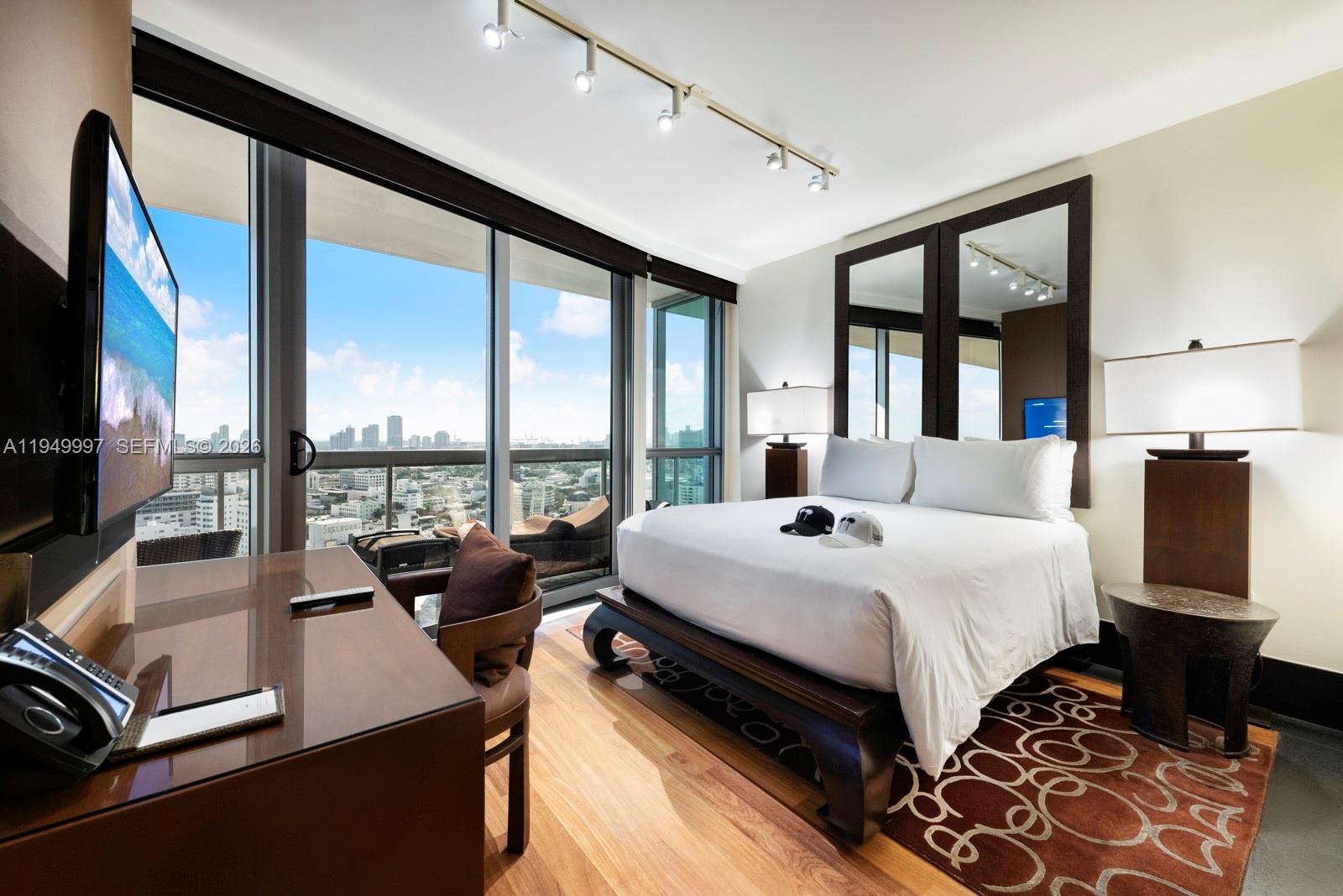 101 20th Street, Unit 3008 Miami Beach, FL 33139 - Photo 15 of 16 a bed room with a bed and a large window