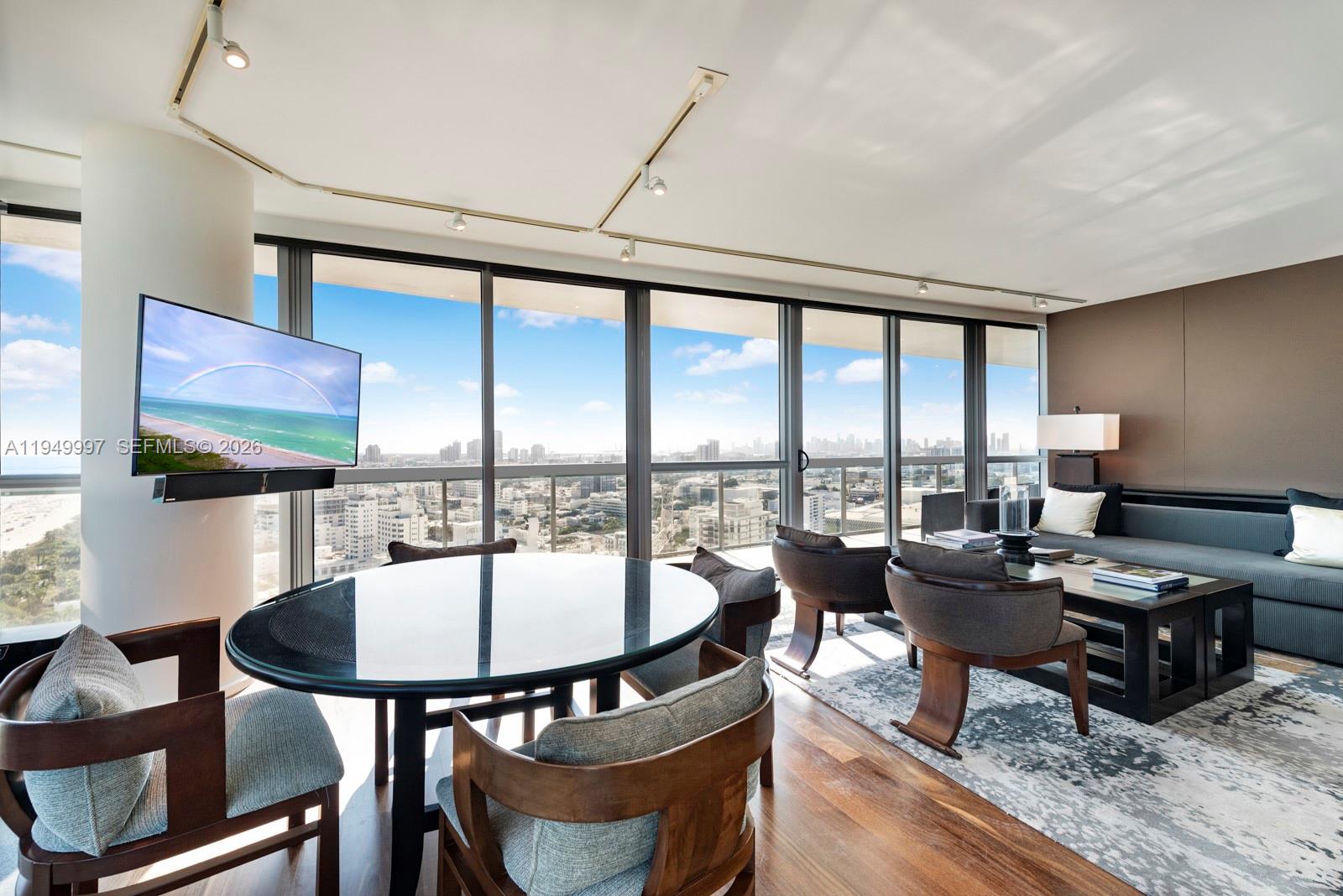 101 20th Street, Unit 3008 Miami Beach, FL 33139 - Photo 7 of 16 a living room with furniture and a floor to ceiling window