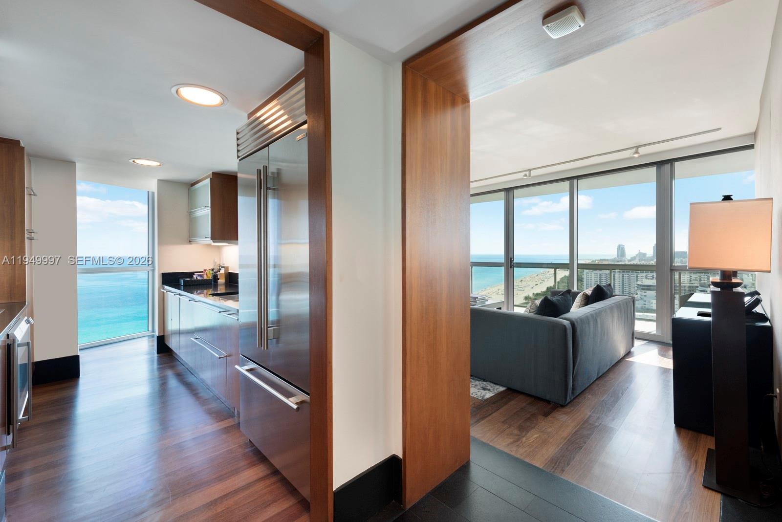 101 20th Street, Unit 3008 Miami Beach, FL 33139 - Photo 8 of 16 a view of a living room with a large window