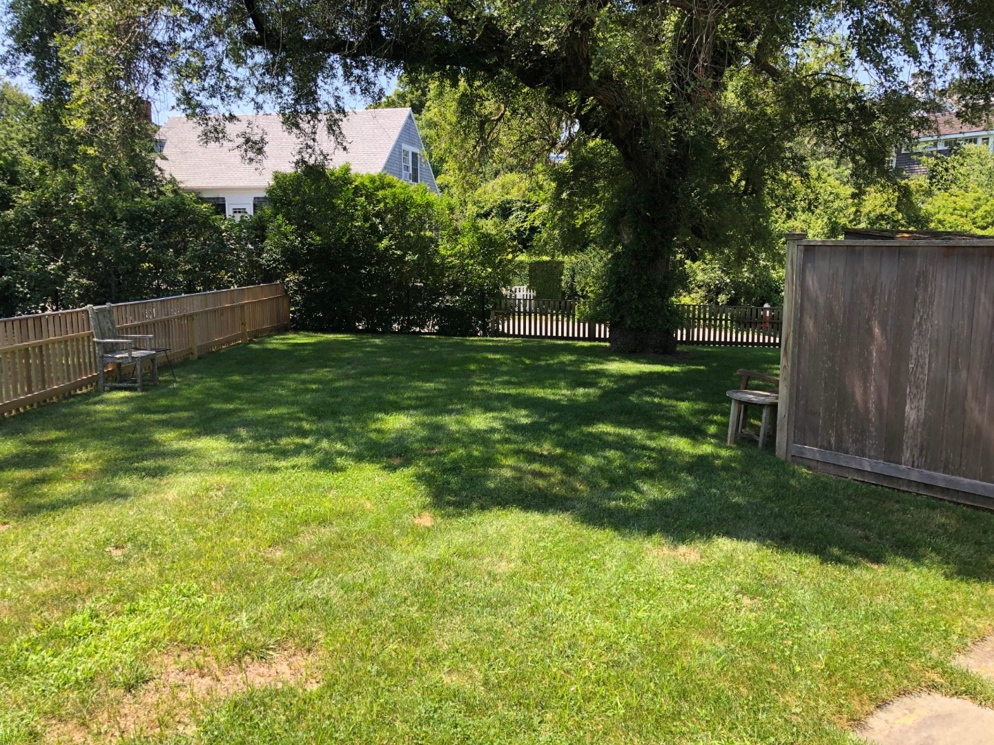 12 Atwood Circle Edgartown, MA 02539 - Photo 11 of 16 a view of a backyard with large trees