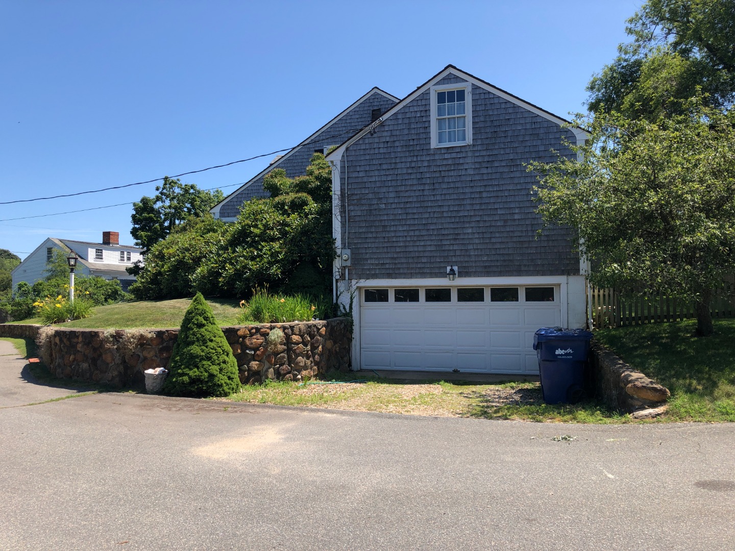12 Atwood Circle Edgartown, MA 02539 - Photo 13 of 16 a front view of a house with a garden