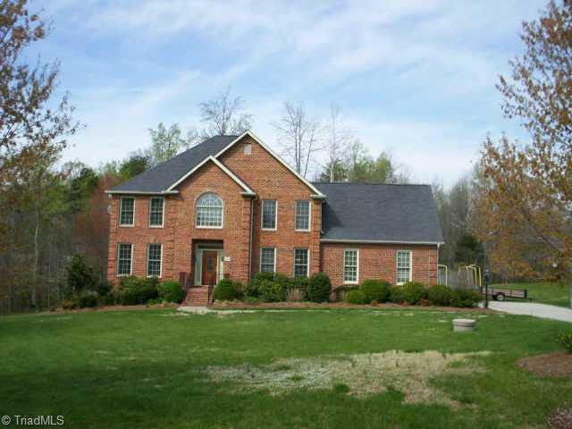 5201 Red Fox Drive Oak Ridge, NC 27310 - Photo 1 of 9 Exterior Front.