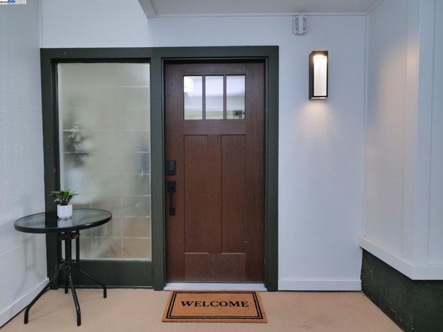 a view of a hallway with seating area