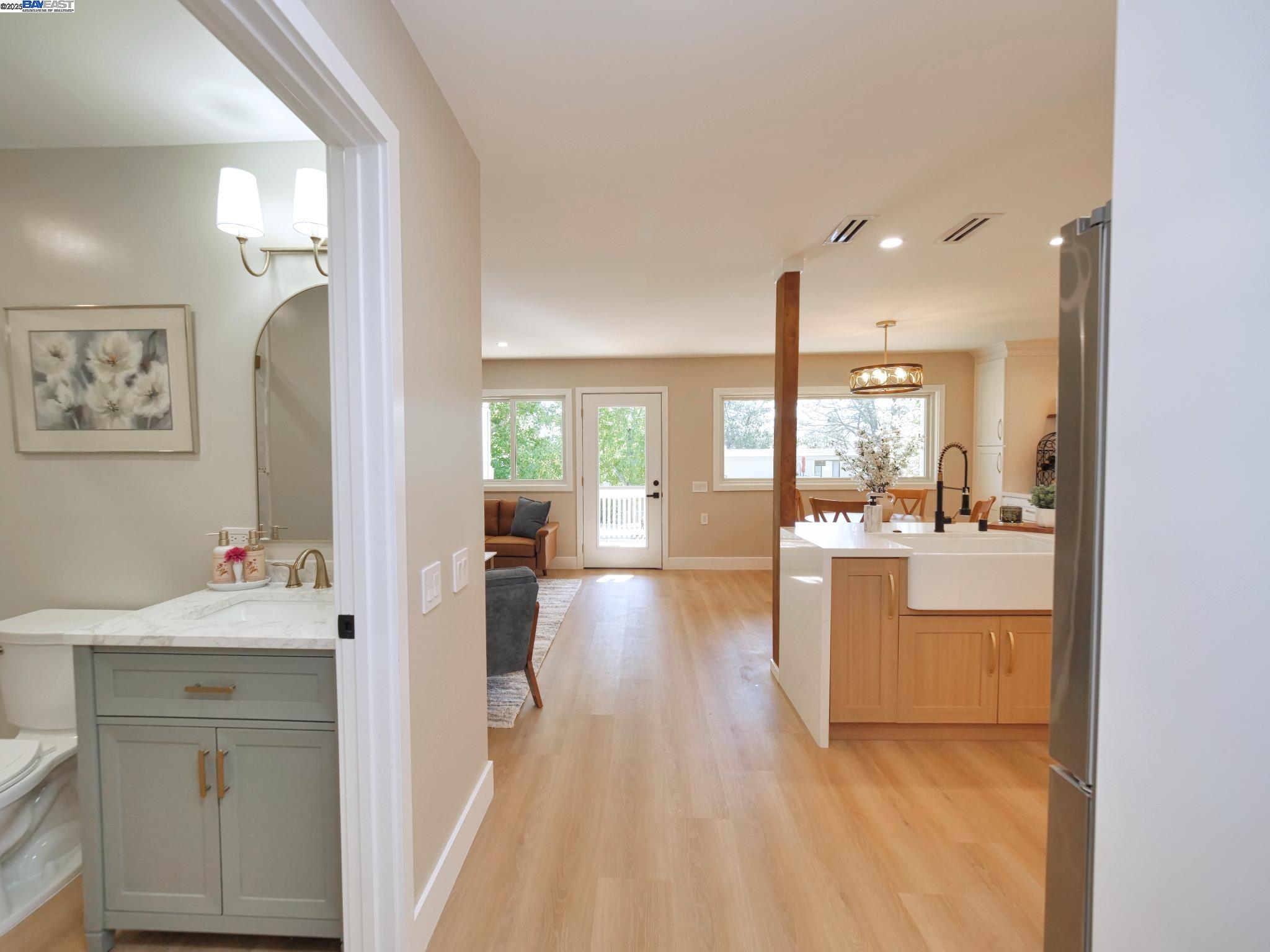1732 Oakmont Drive, Unit 8 Walnut Creek, CA 94595 - Photo 21 of 23 a large white kitchen with a large window