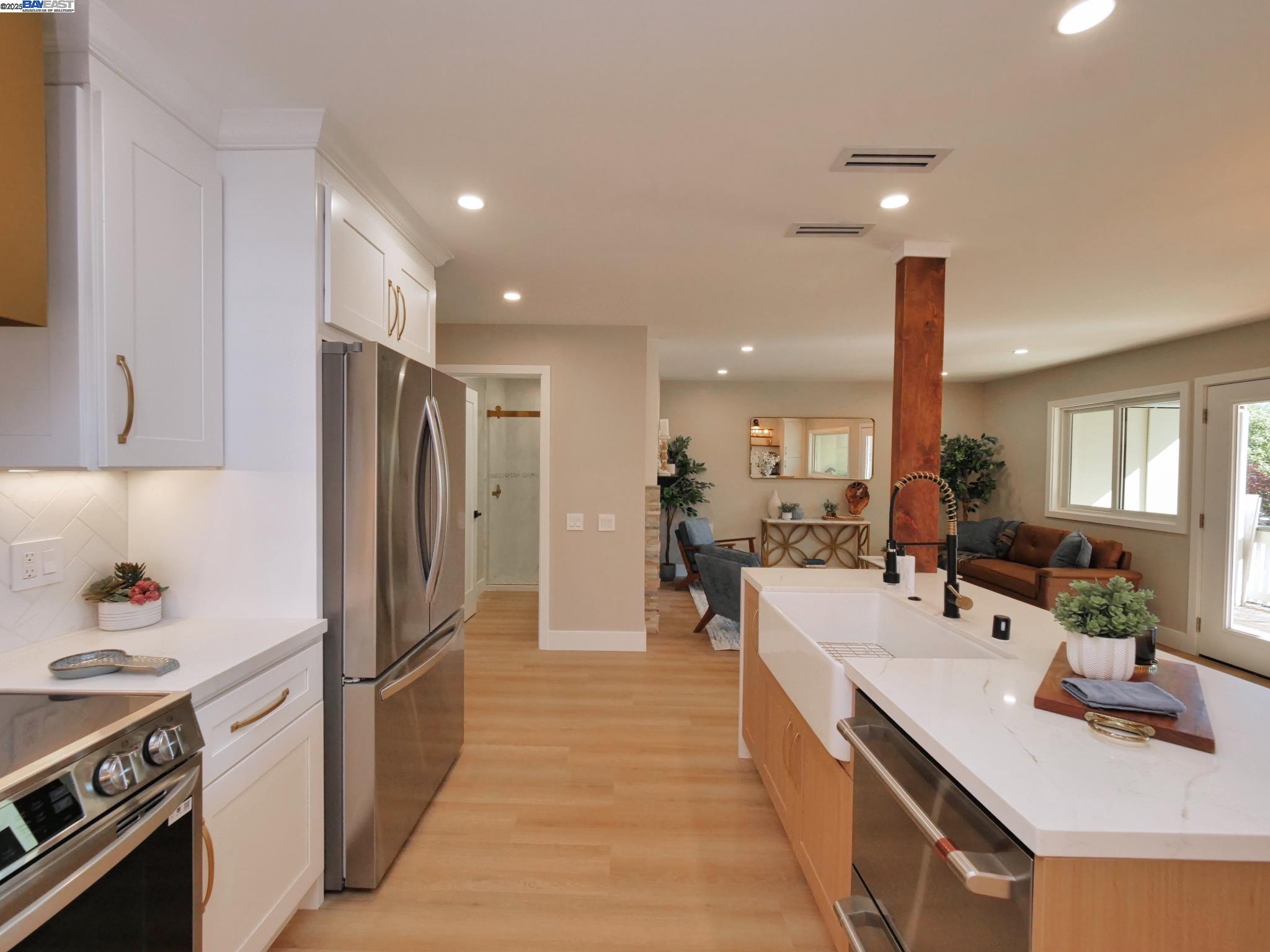 1732 Oakmont Drive, Unit 8 Walnut Creek, CA 94595 - Photo 5 of 23 a kitchen with stainless steel appliances a sink stove and refrigerator