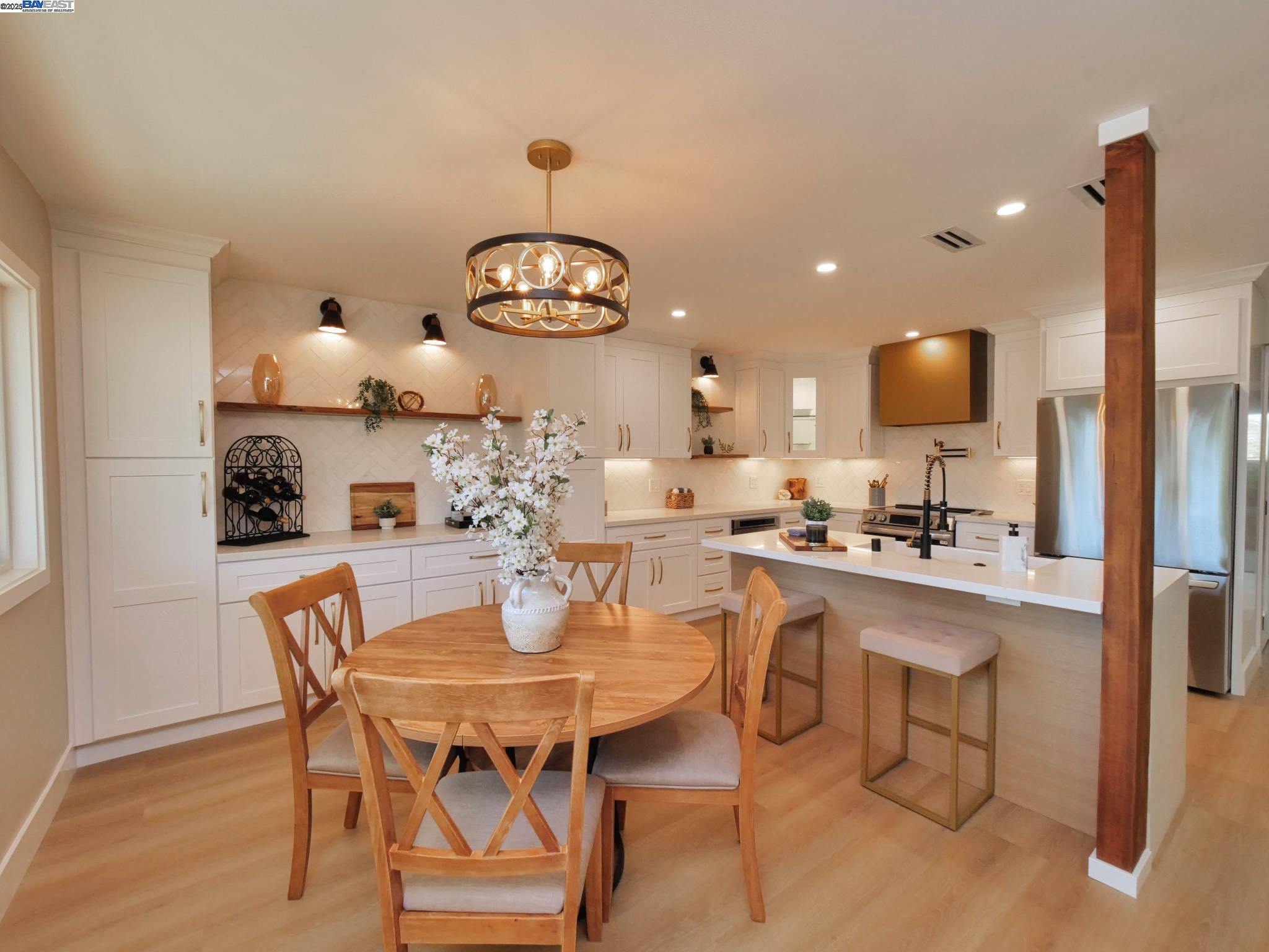 1732 Oakmont Drive, Unit 8 Walnut Creek, CA 94595 - Photo 8 of 23 a kitchen with a dining table and chairs