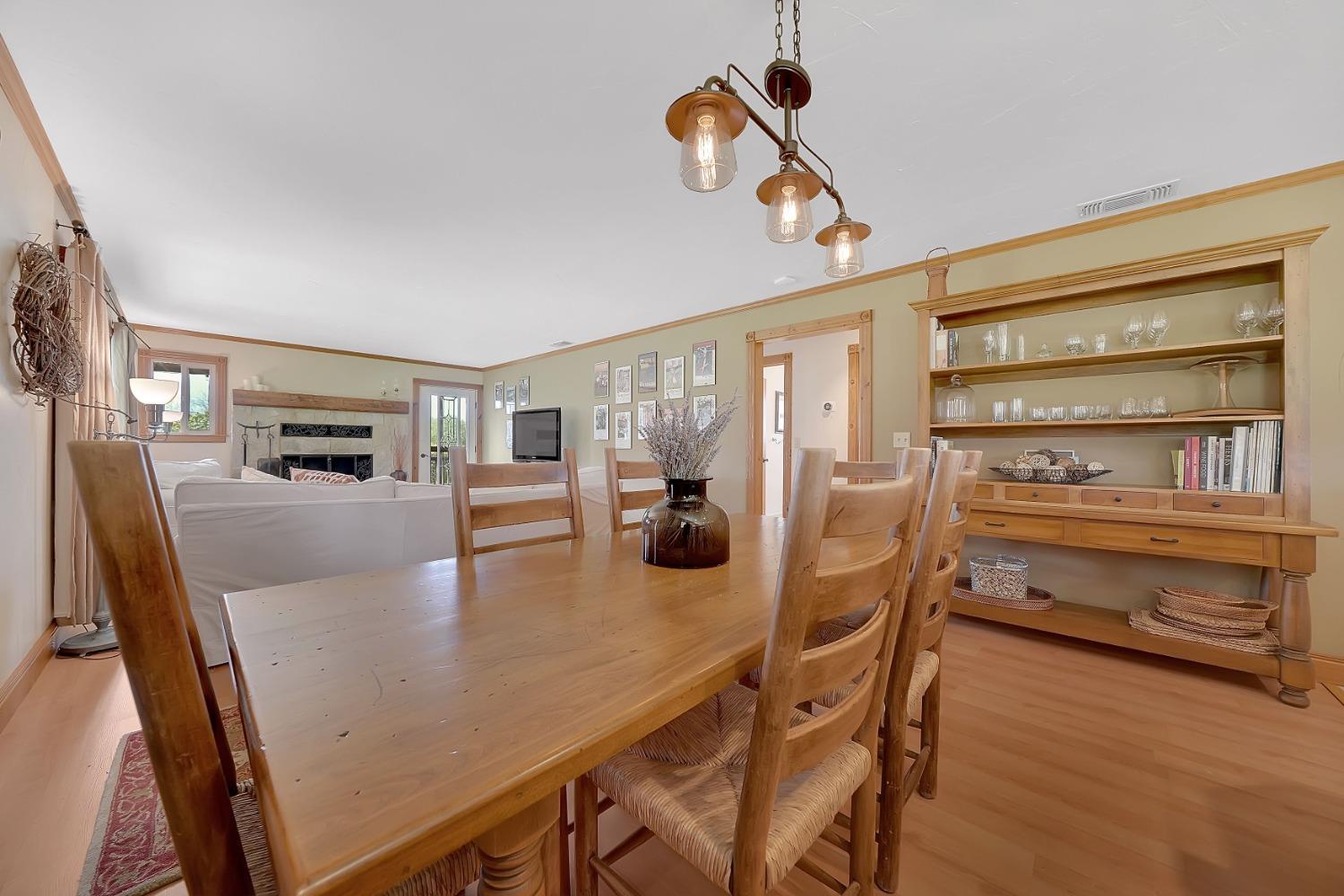 10801 Shenandoah Road Plymouth, CA 95669 - Photo 11 of 45 a view of a dining room with furniture window and wooden floor
