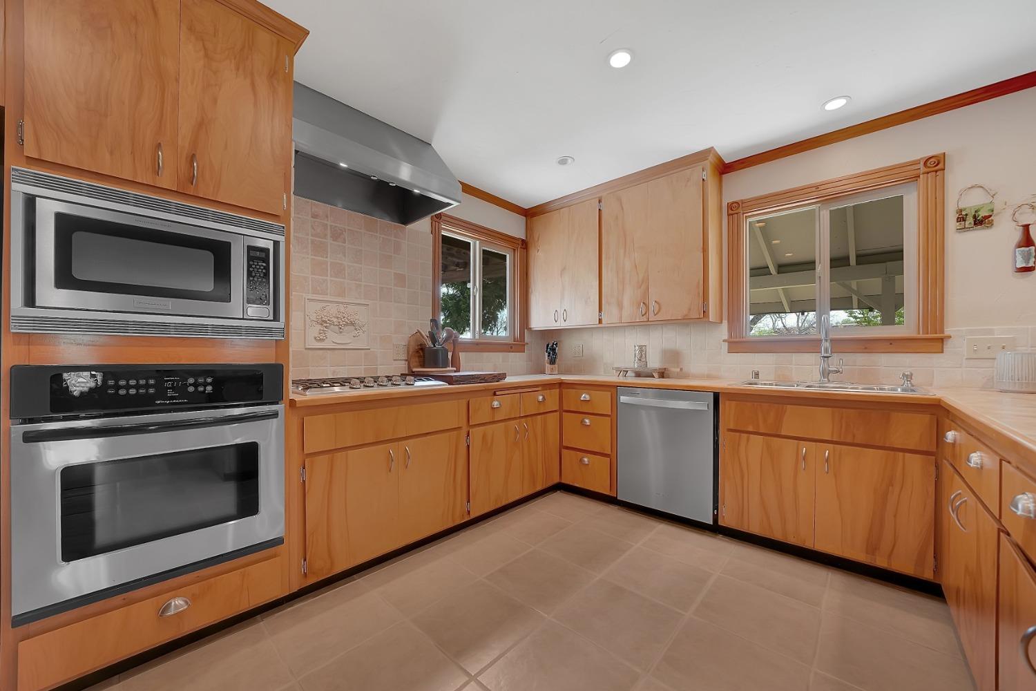 10801 Shenandoah Road Plymouth, CA 95669 - Photo 14 of 45 a kitchen with stainless steel appliances granite countertop a stove microwave and sink