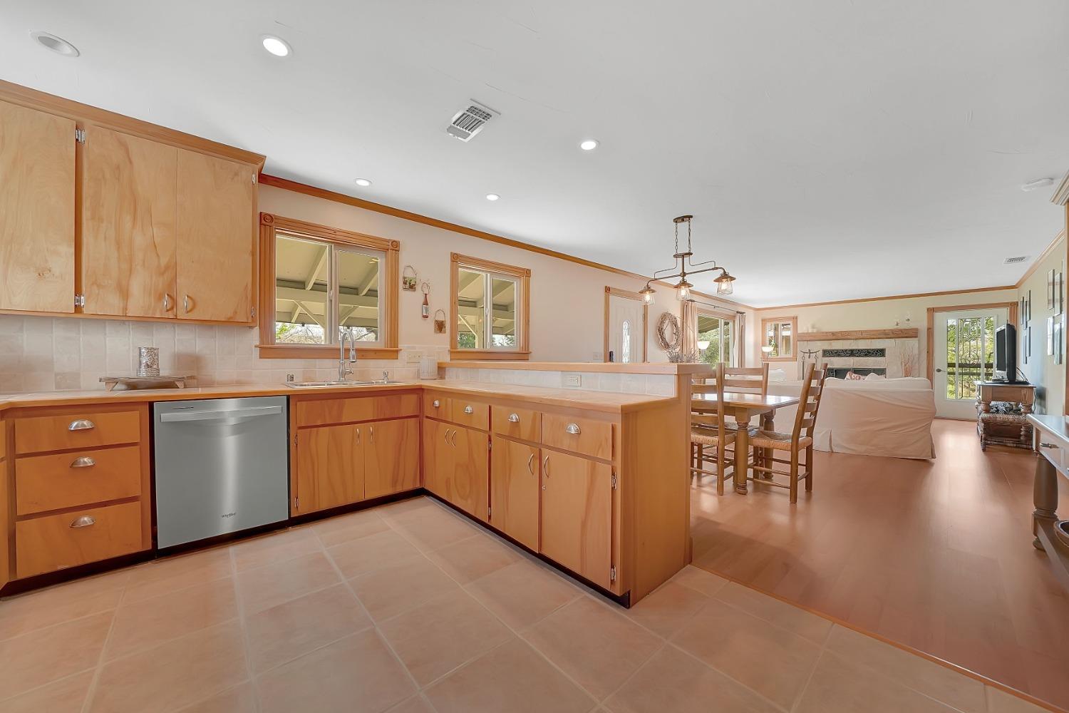 10801 Shenandoah Road Plymouth, CA 95669 - Photo 15 of 45 a kitchen with a sink window and chairs