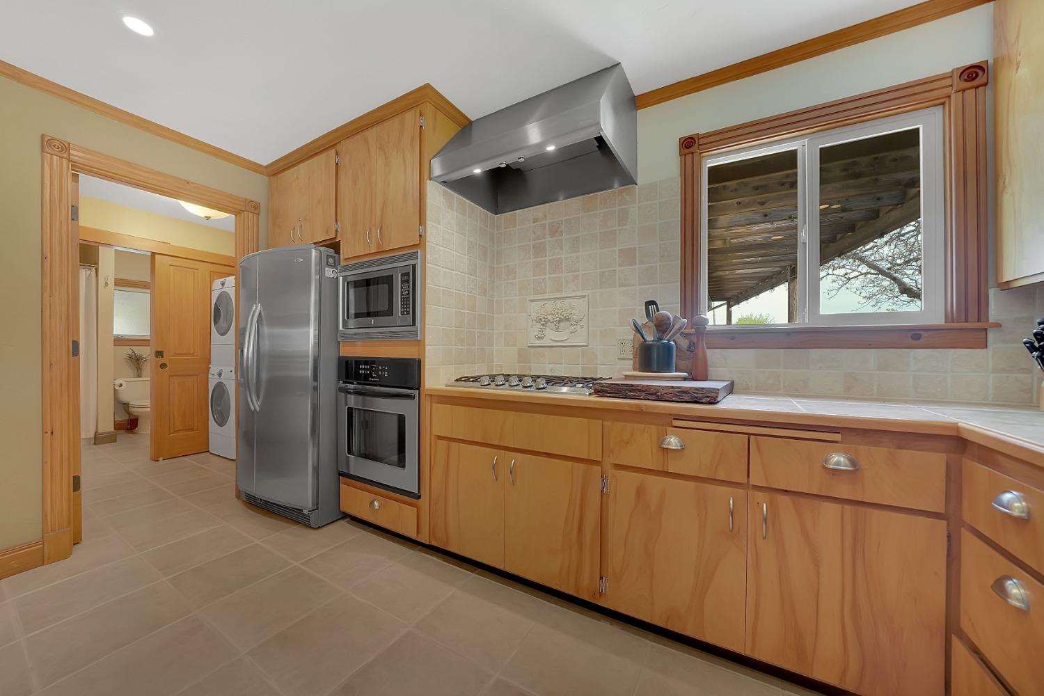 10801 Shenandoah Road Plymouth, CA 95669 - Photo 18 of 45 a kitchen with stainless steel appliances granite countertop a refrigerator and a sink