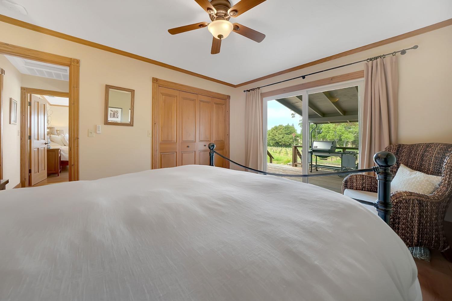 10801 Shenandoah Road Plymouth, CA 95669 - Photo 25 of 45 a bedroom with a bed and a large window