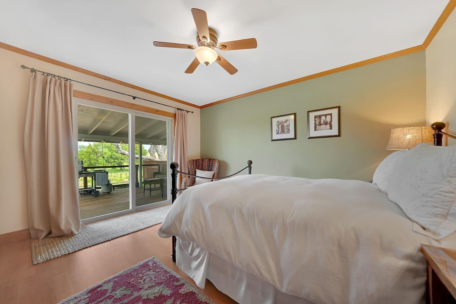 10801 Shenandoah Road Plymouth, CA 95669 - Photo 26 of 45 a bedroom with a bed and a large window