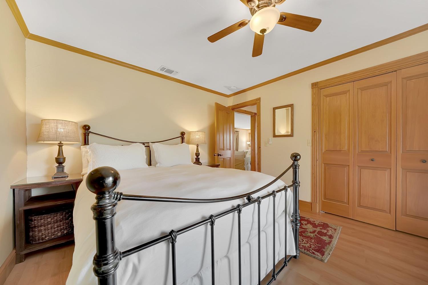 10801 Shenandoah Road Plymouth, CA 95669 - Photo 28 of 45 a bedroom with bed and wooden floor