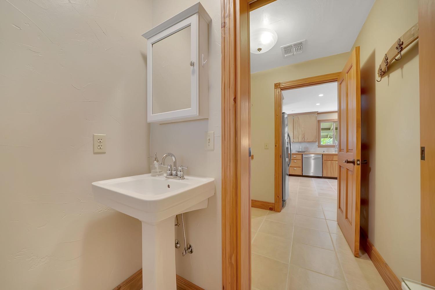 10801 Shenandoah Road Plymouth, CA 95669 - Photo 30 of 45 a bathroom with a sink and a mirror