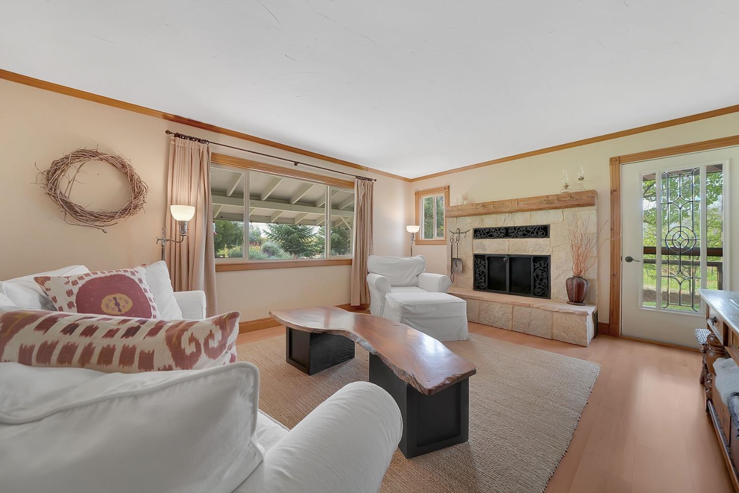 10801 Shenandoah Road Plymouth, CA 95669 - Photo 3 of 45 a living room with furniture and a fireplace