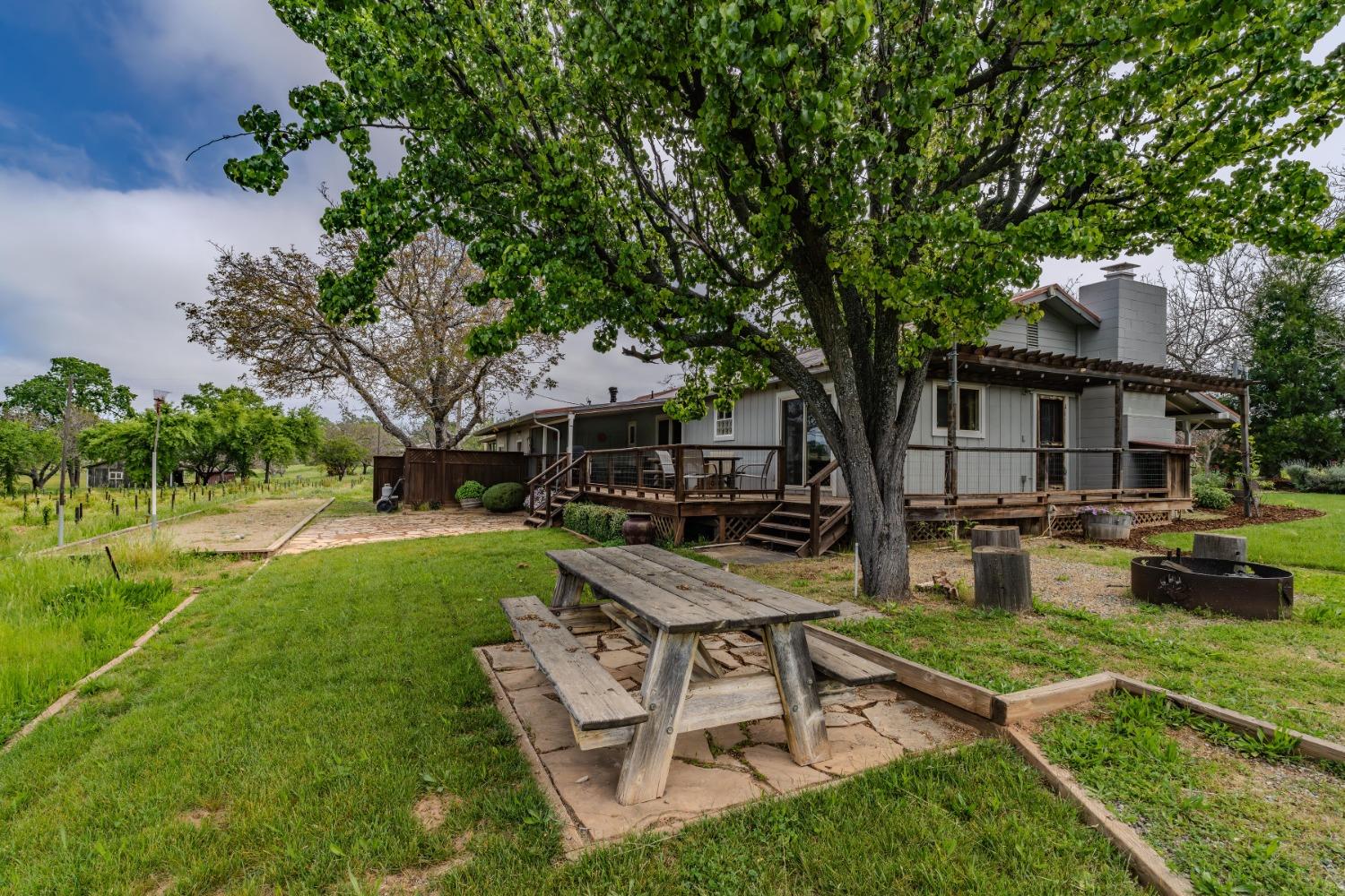 10801 Shenandoah Road Plymouth, CA 95669 - Photo 32 of 45 a view of a house with backyard sitting area and garden