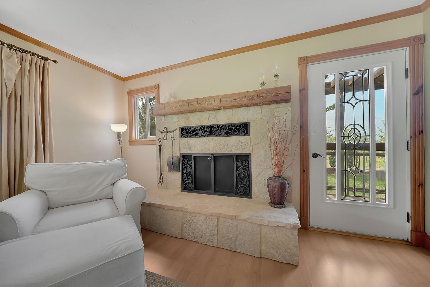 10801 Shenandoah Road Plymouth, CA 95669 - Photo 7 of 45 a living room with furniture and a fireplace