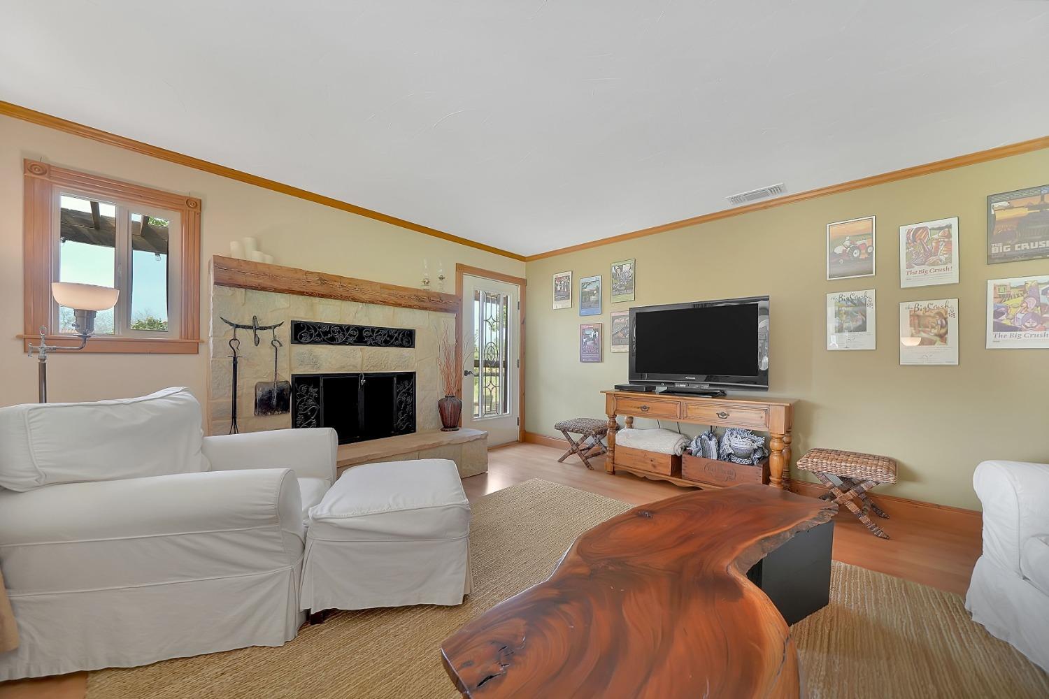 10801 Shenandoah Road Plymouth, CA 95669 - Photo 8 of 45 a living room with furniture and a flat screen tv