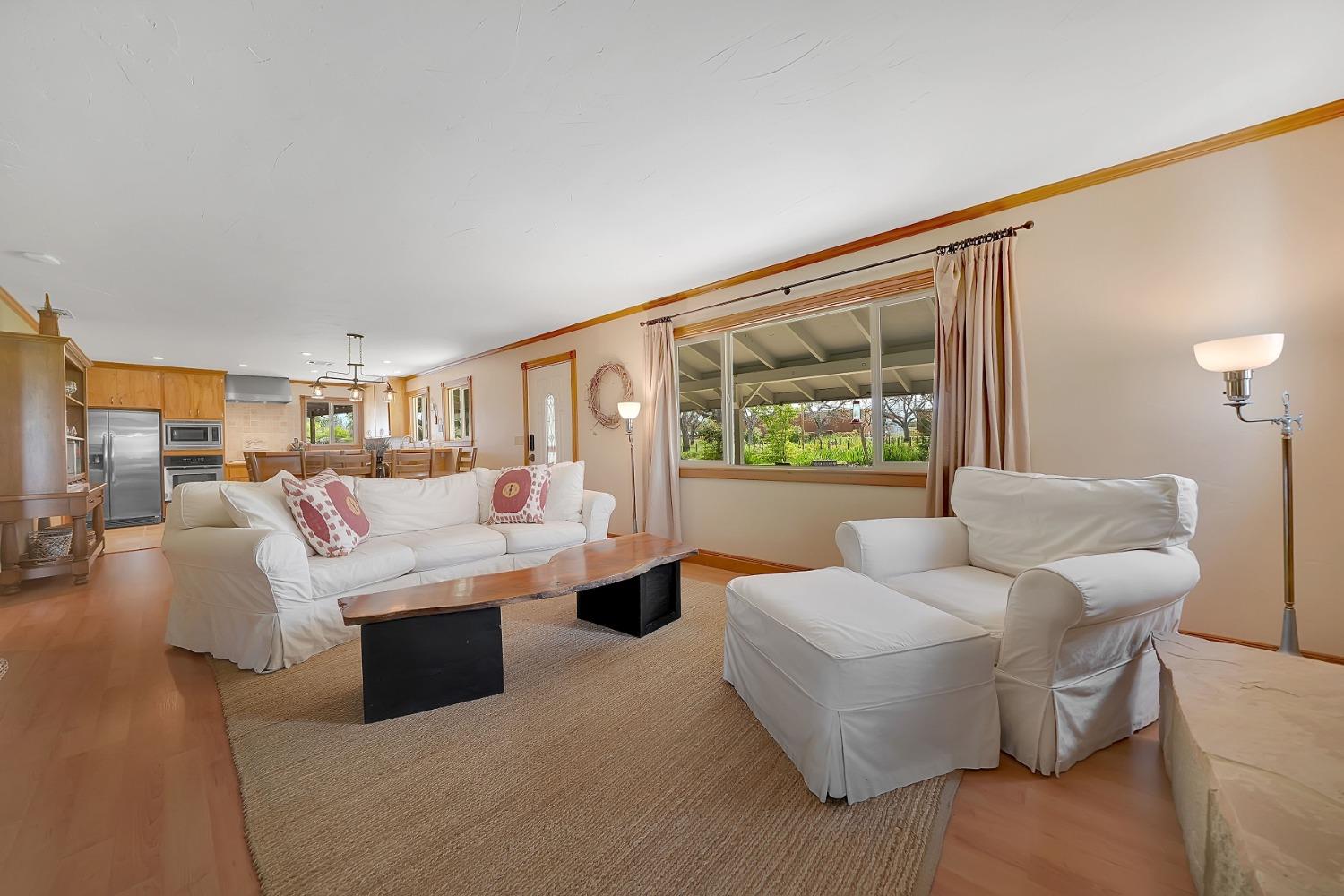 10801 Shenandoah Road Plymouth, CA 95669 - Photo 9 of 45 a living room with furniture and a large window