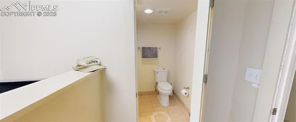 a bathroom with a toilet and a sink