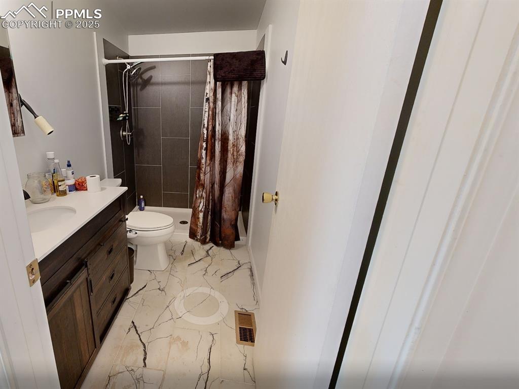 7878 County Road 28 Cotopaxi, CO 81223 - Photo 10 of 23 a bathroom with a sink toilet and shower