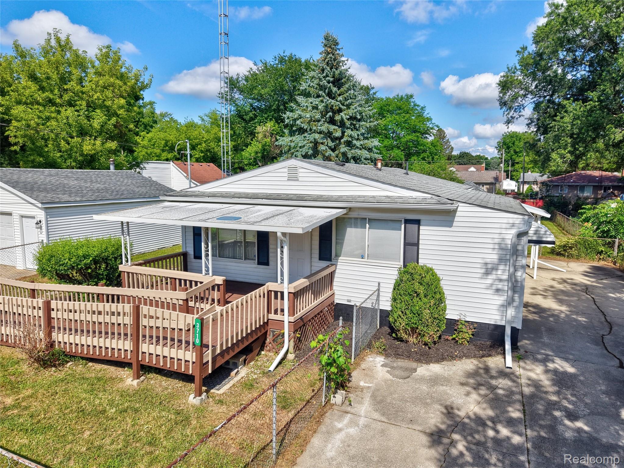 3710 Branch Road Flint, MI 48506 - Photo 12 of 46 Ranch-style residence featuring a covered porch and an accessibility ramp