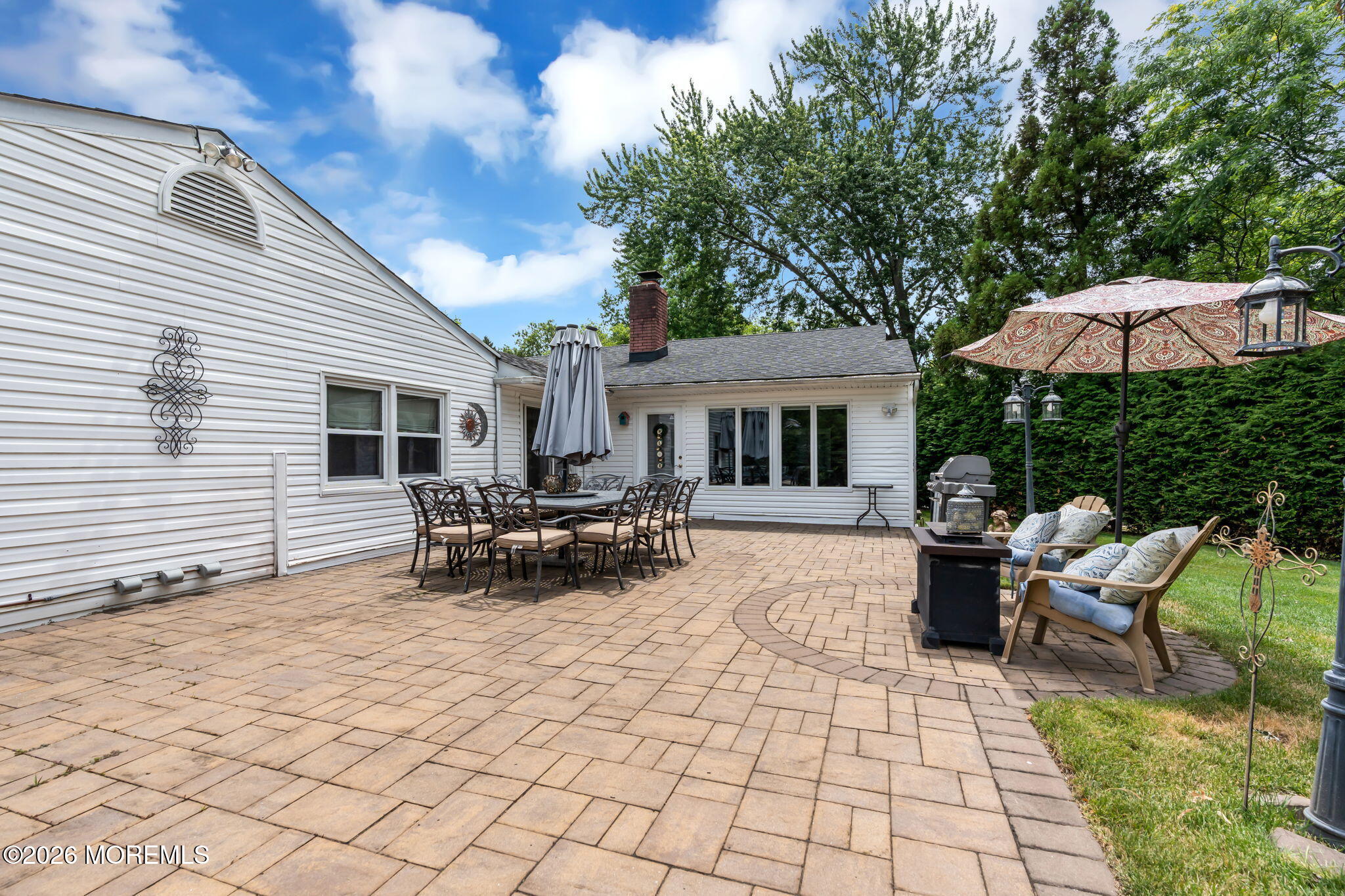 8 Owens Road Marlboro, NJ 07746 - Photo 36 of 39 a view of a house with backyard and sitting area