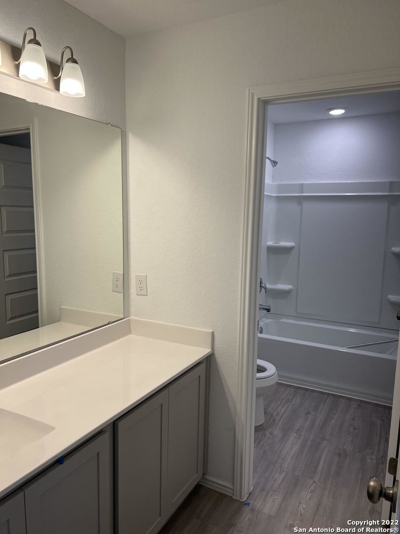2164 Griffith Drive Seguin, TX 78155 - Photo 11 of 21 a bathroom with a sink and a mirror