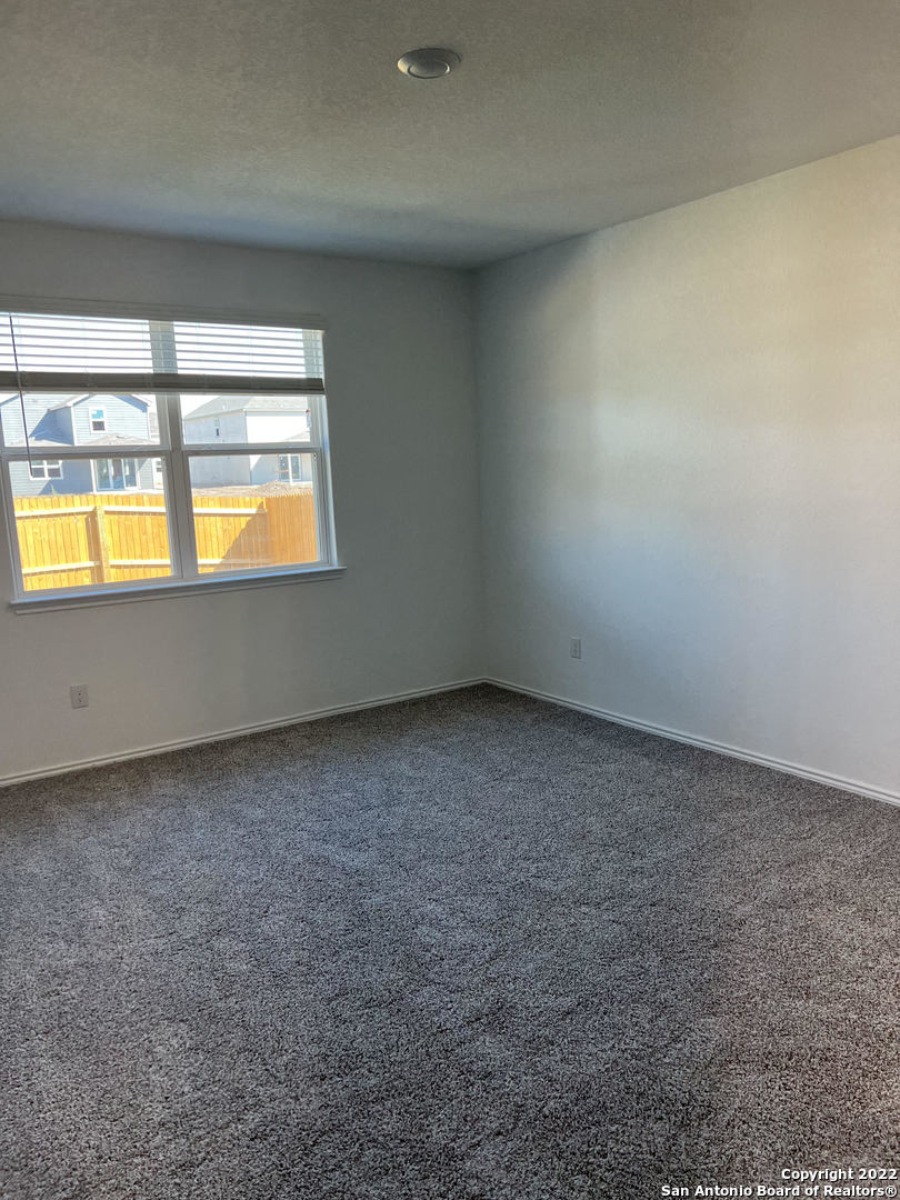 2164 Griffith Drive Seguin, TX 78155 - Photo 9 of 21 an empty room with a fireplace