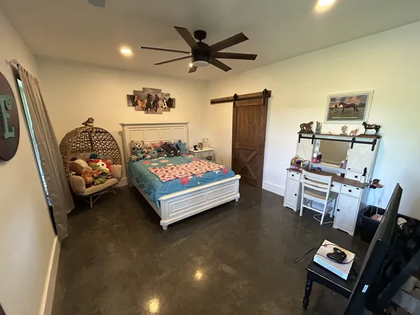 a bedroom with furniture and a bed