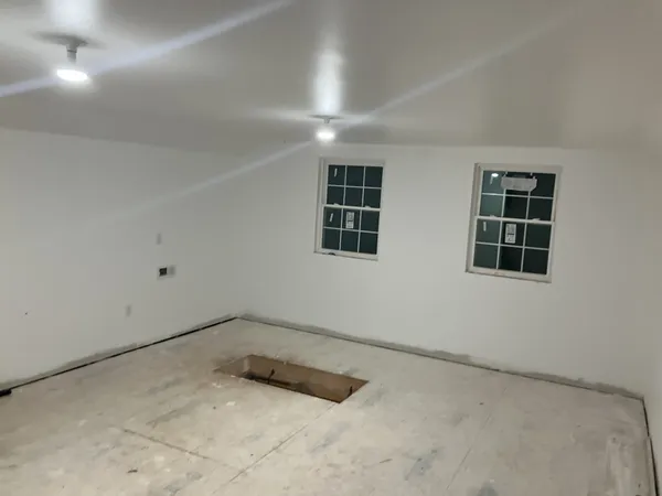 an empty room with windows