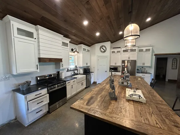a kitchen with granite countertop lots of counter top space