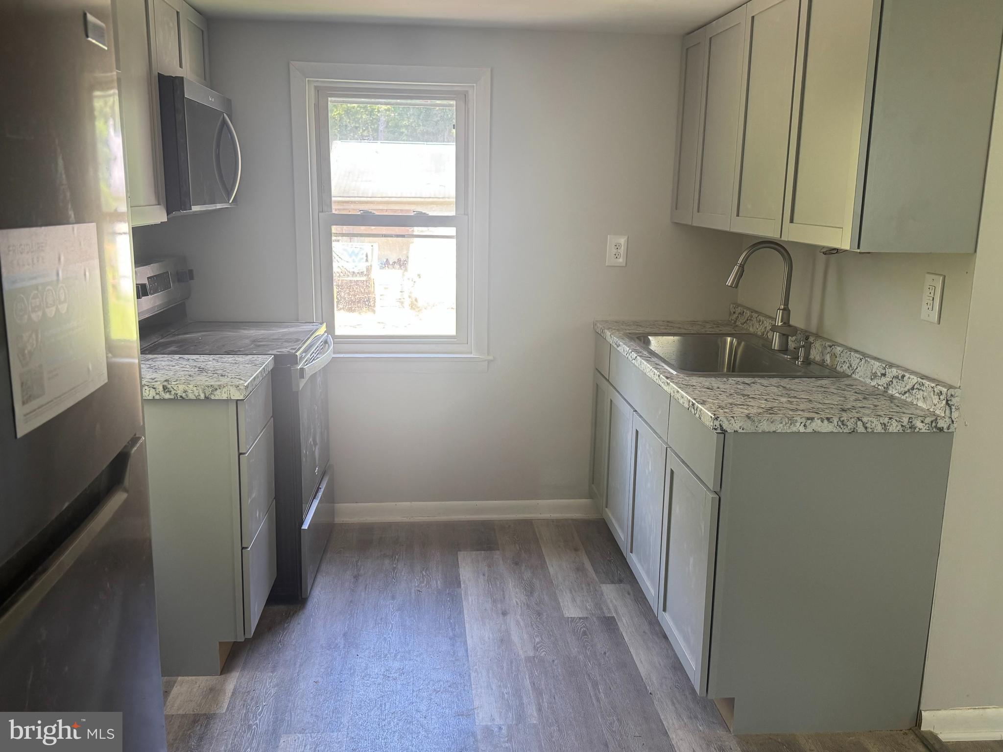 3145 Zepp Road Green Lane, PA 18054 - Photo 4 of 8 a storage room with wooden floor washer and dryer