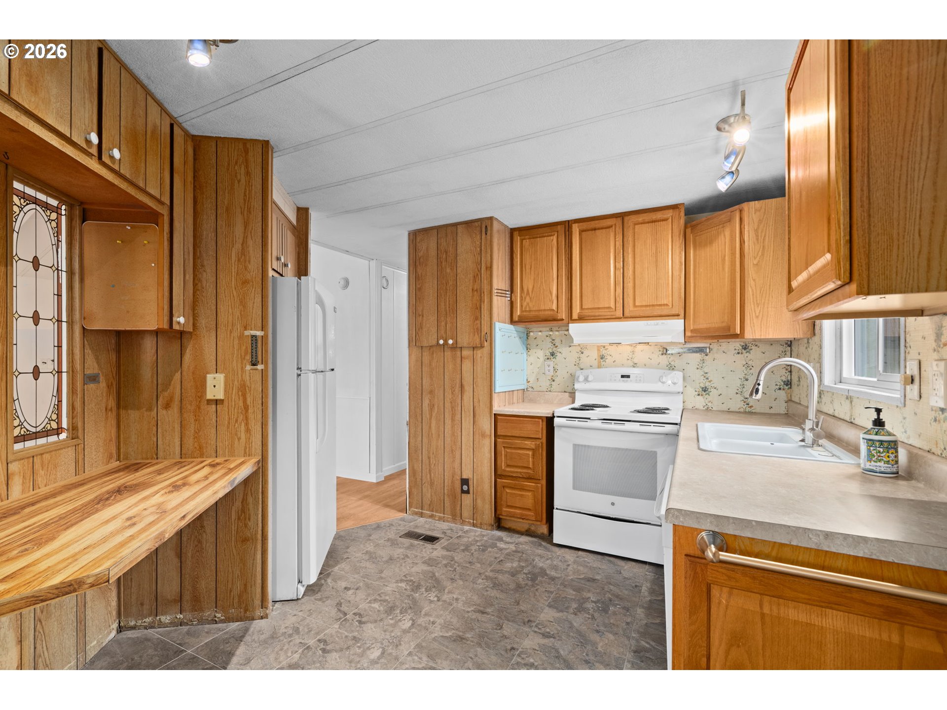 9175 Southwest Link Drive Cornelius, OR 97113 - Photo 12 of 30 a kitchen with a refrigerator and a sink