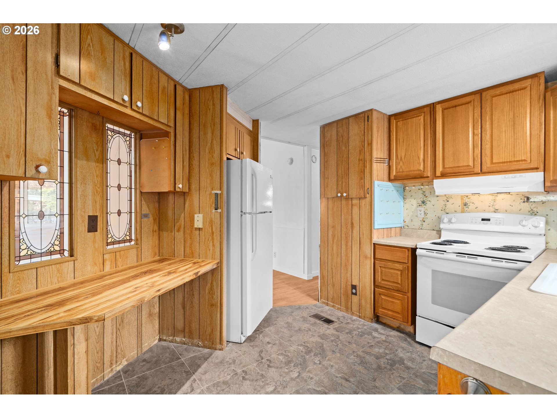 9175 Southwest Link Drive Cornelius, OR 97113 - Photo 13 of 30 a kitchen with stainless steel appliances granite countertop a refrigerator and a stove