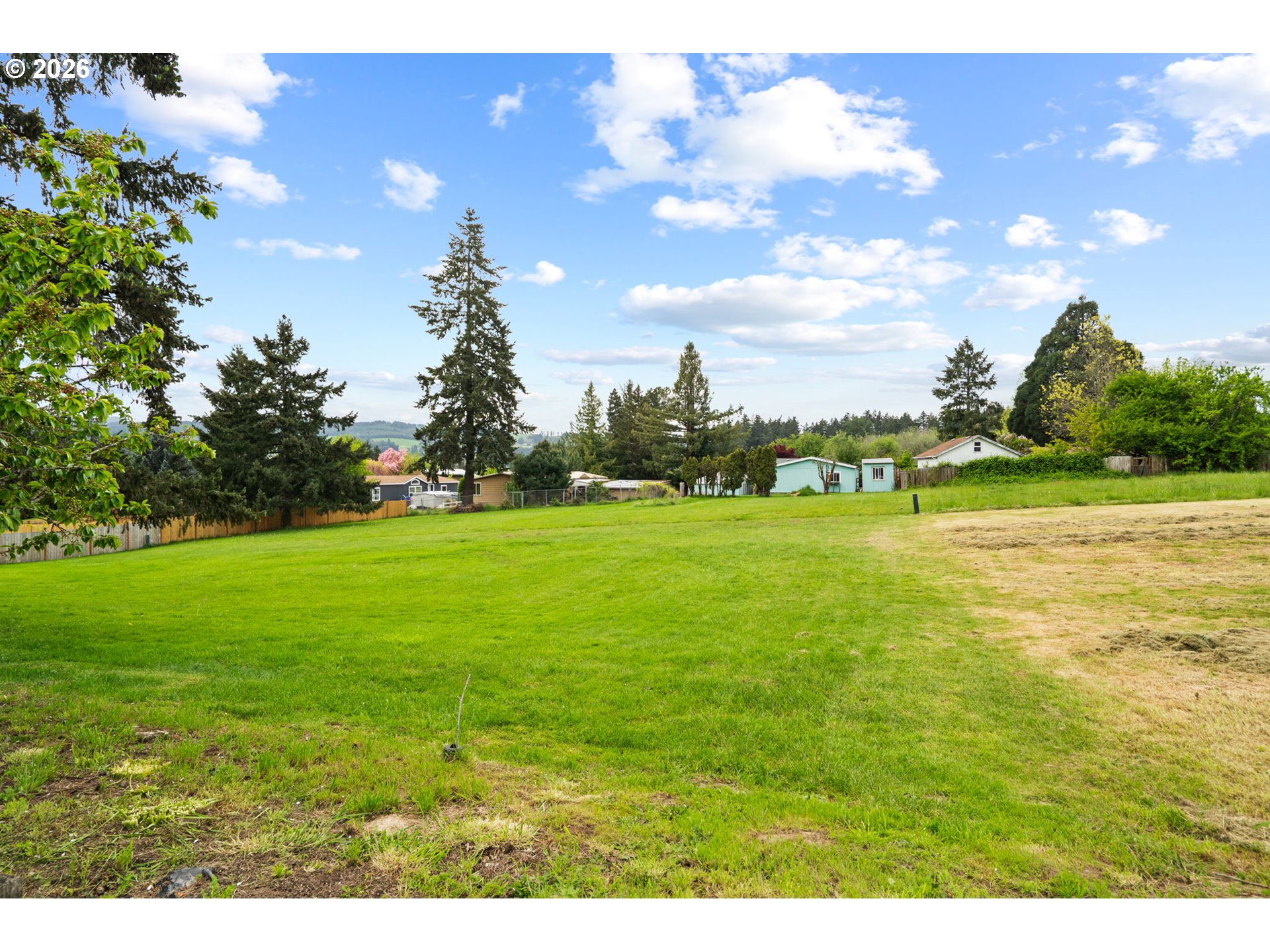 9175 Southwest Link Drive Cornelius, OR 97113 - Photo 26 of 30 a backyard of a house with lots of green space