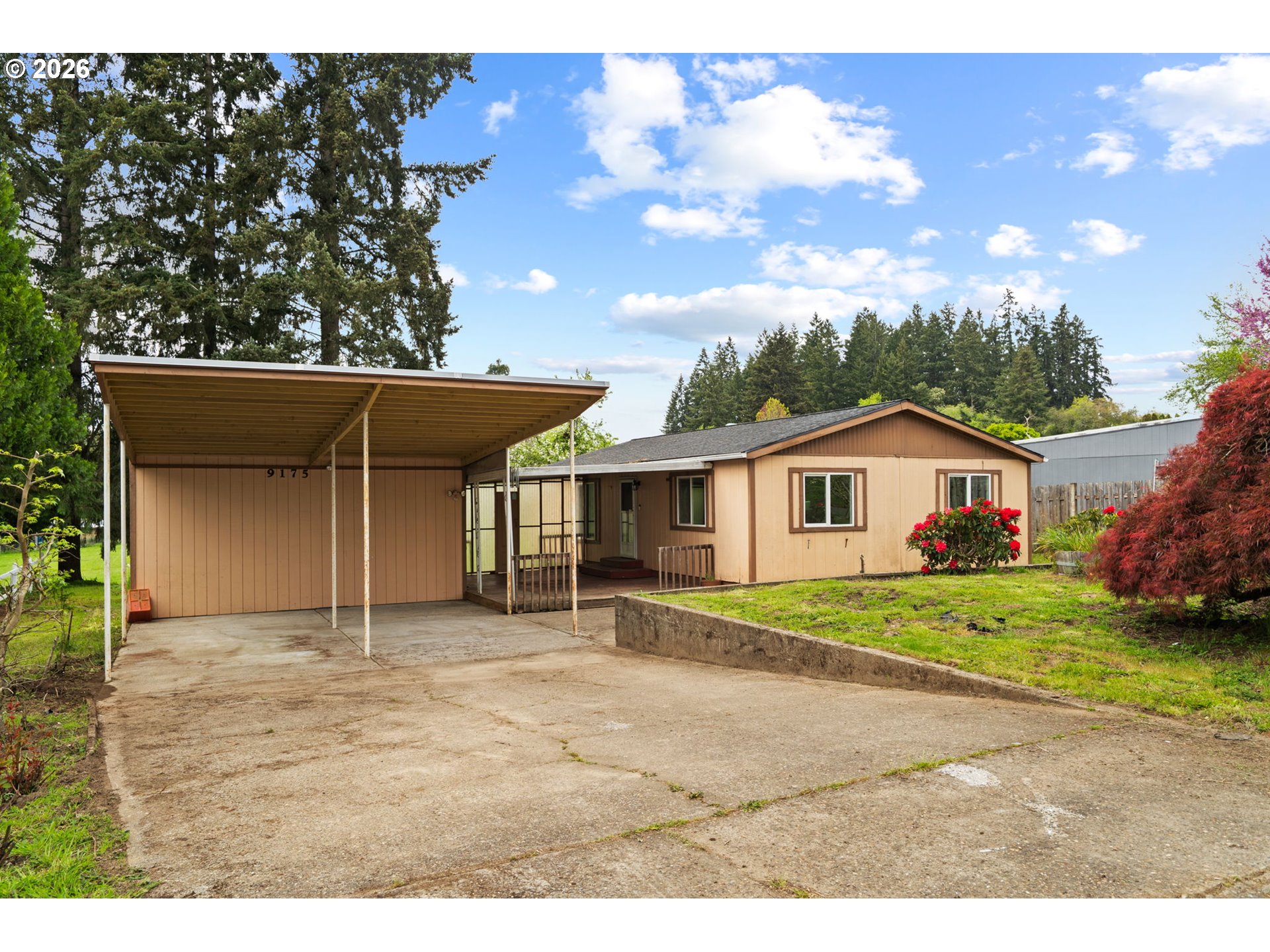 9175 Southwest Link Drive Cornelius, OR 97113 - Photo 4 of 30 a house view with a garden space