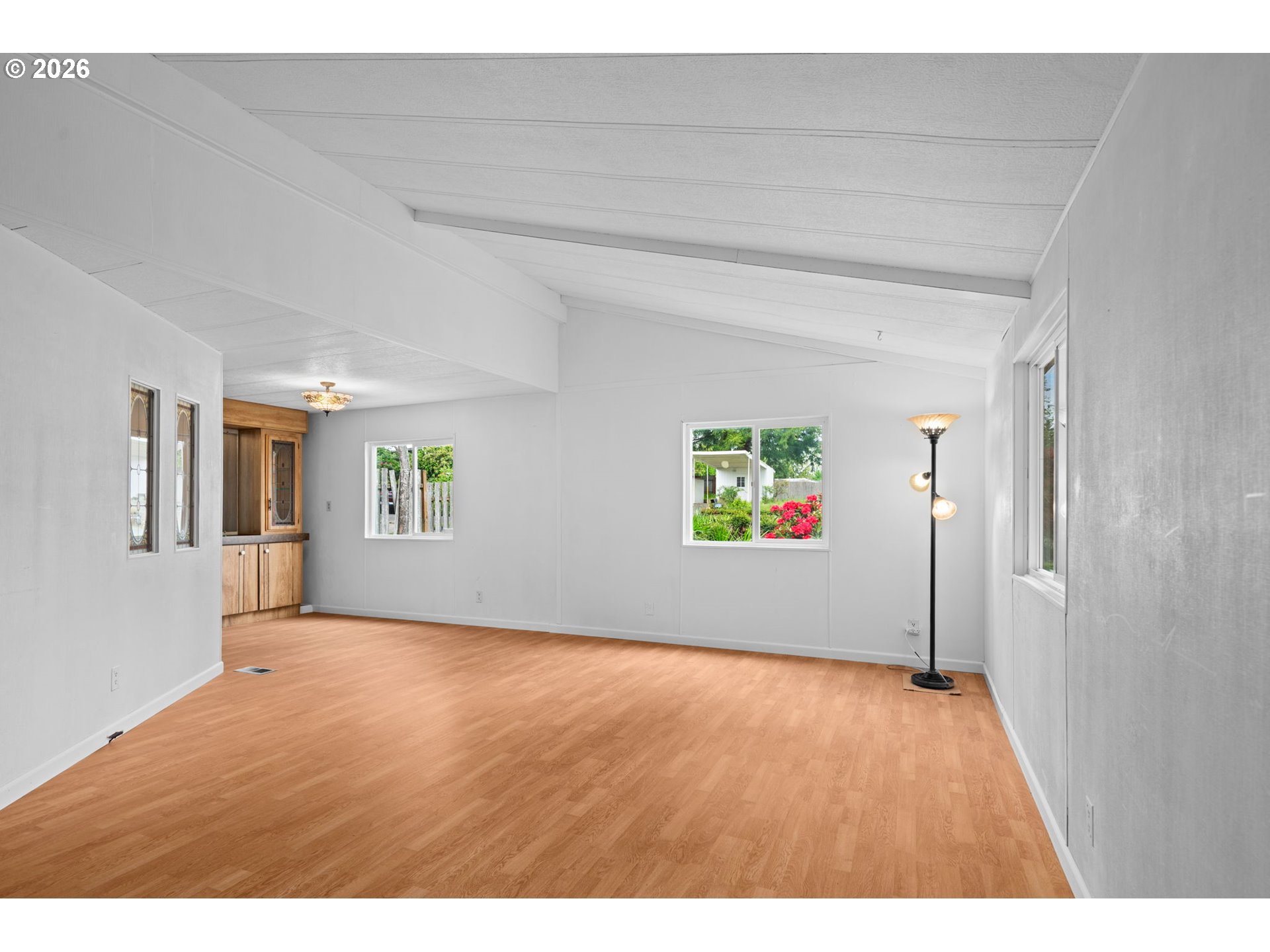 9175 Southwest Link Drive Cornelius, OR 97113 - Photo 6 of 30 a view of an empty room with window and wooden floor