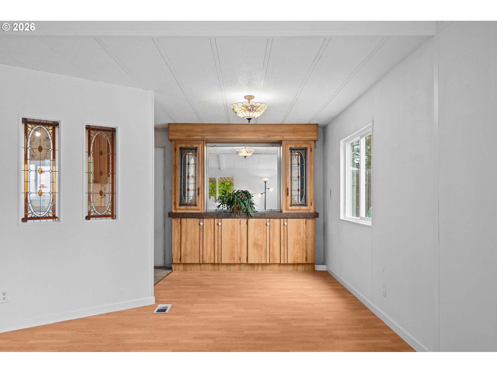 9175 Southwest Link Drive Cornelius, OR 97113 - Photo 9 of 30 a view of a room with wooden floor and a window