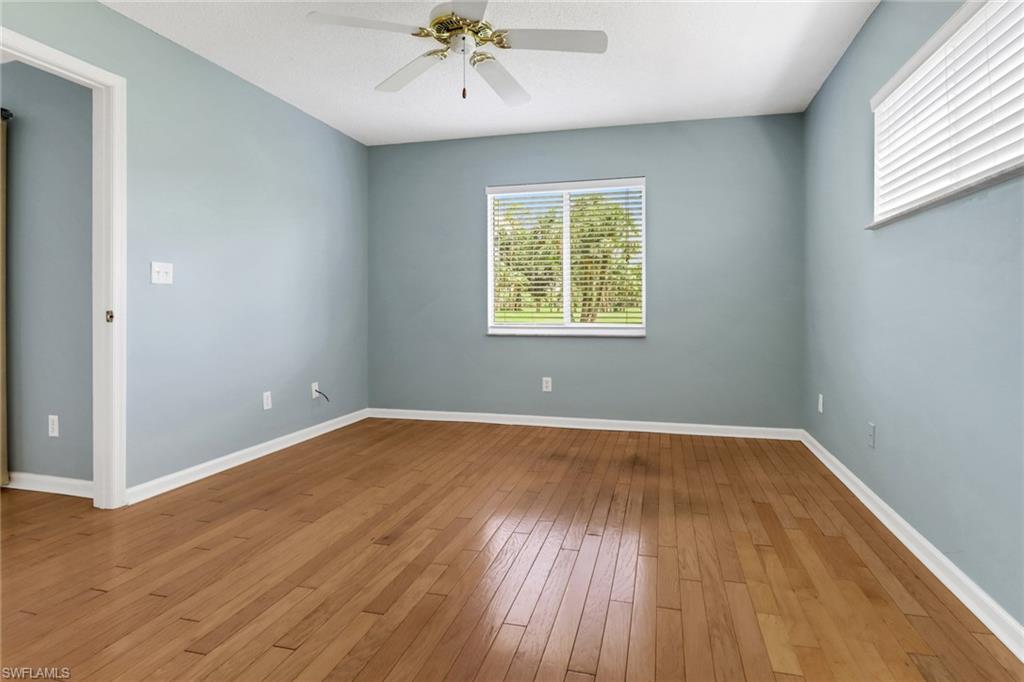 4556 Andover Way, Unit E106 Naples, FL 34112 - Photo 17 of 40 Spare room featuring a ceiling fan and light wood-type flooring
